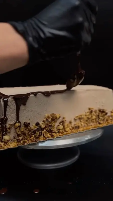 Our baker finishing a cake