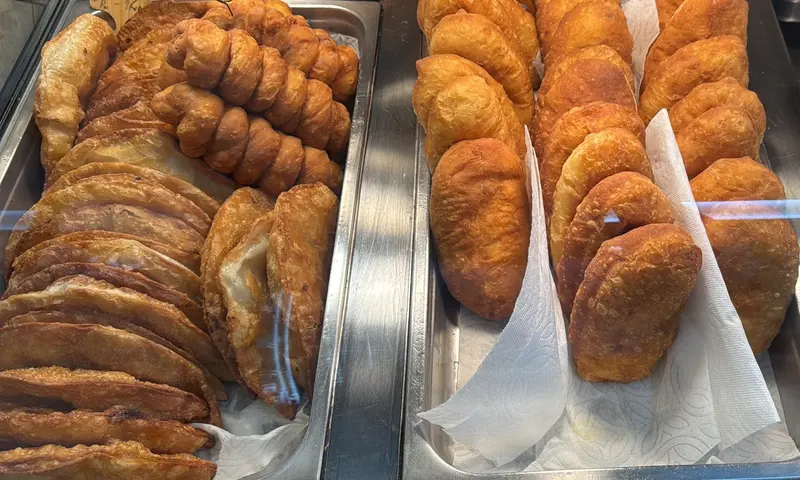 Pirozhki and chebureki in the pastry case